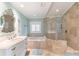 Bathroom with soaking tub, walk-in shower, and white vanity at 8213 Midnight Pass Rd, Sarasota, FL 34242