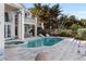 Inviting pool and spa surrounded by a large patio at 8213 Midnight Pass Rd, Sarasota, FL 34242