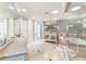 Large bathroom with double vanities, soaking tub, and walk-in shower at 8213 Midnight Pass Rd, Sarasota, FL 34242
