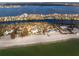 Aerial view of beachfront property with private beach access at 8213 Midnight Pass Rd, Sarasota, FL 34242