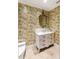 Elegant powder room with unique sink vanity and bird wallpaper at 8213 Midnight Pass Rd, Sarasota, FL 34242