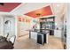 Gourmet kitchen with island, wine cooler, and granite countertops at 8213 Midnight Pass Rd, Sarasota, FL 34242