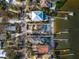 Aerial view of waterfront property with private pool and dock at 8213 Midnight Pass Rd, Sarasota, FL 34242
