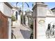Grand entrance with ornate gate and stonework at 8213 Midnight Pass Rd, Sarasota, FL 34242