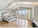 Main bedroom with water views and hardwood floors at 8213 Midnight Pass Rd, Sarasota, FL 34242