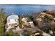 Luxury waterfront home with driveway and private dock at 8213 Midnight Pass Rd, Sarasota, FL 34242