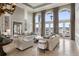 Spacious living room with water views and high ceilings at 8213 Midnight Pass Rd, Sarasota, FL 34242