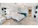 Luxurious main bedroom with water views and a sitting area at 8213 Midnight Pass Rd, Sarasota, FL 34242
