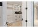 Large walk-in closet with ample shelving and storage at 8213 Midnight Pass Rd, Sarasota, FL 34242