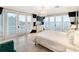 Main bedroom with water views, large windows, and a luxurious feel at 8213 Midnight Pass Rd, Sarasota, FL 34242