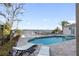 Inviting pool and spa with waterfront views at 8213 Midnight Pass Rd, Sarasota, FL 34242