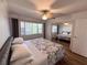 Main bedroom with large window and mirrored closet doors at 1101 Victoria Dr # 20, Dunedin, FL 34698