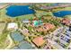 Aerial view of community highlighting the pool and clubhouse at 5016 Savona Run, Bradenton, FL 34211