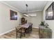 Bright dining room with a rustic wooden table and chandelier at 5016 Savona Run, Bradenton, FL 34211