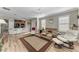 Open-concept living room and kitchen area with hardwood floors at 5016 Savona Run, Bradenton, FL 34211