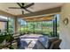 Relaxing screened porch with brick pavers and comfy wicker furniture at 5016 Savona Run, Bradenton, FL 34211