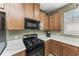 Modern kitchen with black appliances and white quartz countertops at 5016 Savona Run, Bradenton, FL 34211