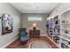 Cozy library with built-in bookshelves and a comfortable reading chair at 5016 Savona Run, Bradenton, FL 34211