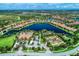 Community overview featuring a lake, clubhouse, and tennis courts at 5016 Savona Run, Bradenton, FL 34211
