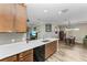 Kitchen with island, stainless steel appliances, and wood cabinets at 5016 Savona Run, Bradenton, FL 34211