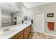 Modern bathroom with dual vanity sinks and a large walk-in shower at 5016 Savona Run, Bradenton, FL 34211