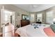 Bright bedroom with access to a private balcony and ample closet space at 5016 Savona Run, Bradenton, FL 34211