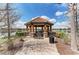 Quaint gazebo with seating overlooking a lake at 5016 Savona Run, Bradenton, FL 34211