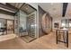 Modern temperature-controlled wine cellar with glass enclosure at 5016 Savona Run, Bradenton, FL 34211