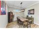 Casual dining area with a rustic wooden table and eclectic decor at 5016 Savona Run, Bradenton, FL 34211