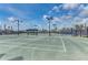 Well-maintained tennis courts with ample space and seating areas at 5016 Savona Run, Bradenton, FL 34211