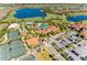 Aerial view of community with pool, tennis courts, and clubhouse at 5016 Savona Run, Bradenton, FL 34211