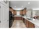 Eat-in kitchen with wood cabinets and ample counter space at 5016 Savona Run, Bradenton, FL 34211