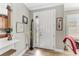 Bright and airy entryway with hardwood floors and access to the kitchen at 5016 Savona Run, Bradenton, FL 34211
