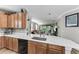 Open kitchen with a breakfast bar overlooking the living room at 5016 Savona Run, Bradenton, FL 34211