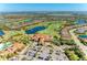 Aerial view of community showing homes, golf course, and clubhouse at 5016 Savona Run, Bradenton, FL 34211