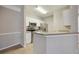 Kitchen features stainless steel appliances and white cabinets at 5122 Northridge Rd # 207, Sarasota, FL 34238