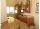 Community kitchen with granite countertops and wood cabinets at 5122 Northridge Rd # 207, Sarasota, FL 34238