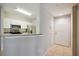 Modern kitchen with stainless steel appliances and white cabinets at 5122 Northridge Rd # 207, Sarasota, FL 34238