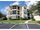 Three-story building with balconies and landscaping at 5122 Northridge Rd # 207, Sarasota, FL 34238