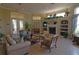 Community living area with fireplace and comfortable seating at 5122 Northridge Rd # 207, Sarasota, FL 34238