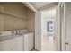 Convenient laundry room with washer and dryer at 5122 Northridge Rd # 207, Sarasota, FL 34238