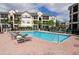 Community pool with plenty of lounge chairs at 5122 Northridge Rd # 207, Sarasota, FL 34238