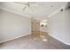 Open living room with tile floors and views into kitchen area at 5122 Northridge Rd # 207, Sarasota, FL 34238