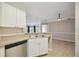 Kitchen features stainless steel appliances and white cabinets at 5122 Northridge Rd # 207, Sarasota, FL 34238