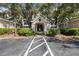 Community building entrance with landscaping and parking at 5122 Northridge Rd # 207, Sarasota, FL 34238