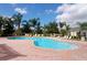 Freeform community pool with lounge chairs at 5122 Northridge Rd # 207, Sarasota, FL 34238
