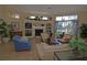 Community living room with fireplace and comfortable seating at 5122 Northridge Rd # 207, Sarasota, FL 34238
