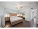 Main bedroom with king bed and access to hallway at 2425 Clematis St, Sarasota, FL 34239