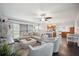 Bright living room with comfy sectional sofa and hardwood floors at 2425 Clematis St, Sarasota, FL 34239