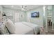 Spacious bedroom with king-size bed and large TV at 2425 Clematis St, Sarasota, FL 34239